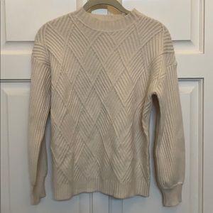 Cable knit sweater in cream